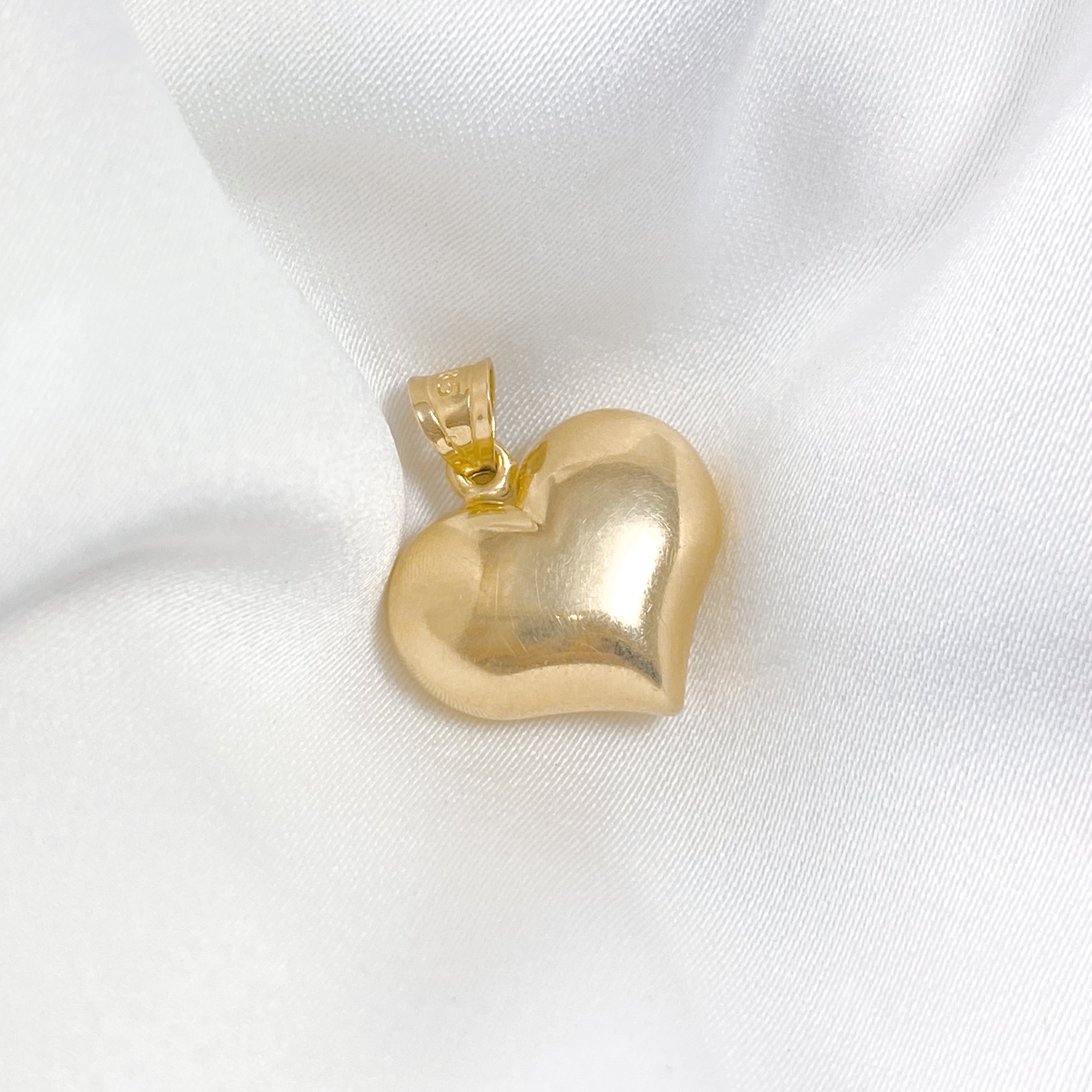 Structured heart charm